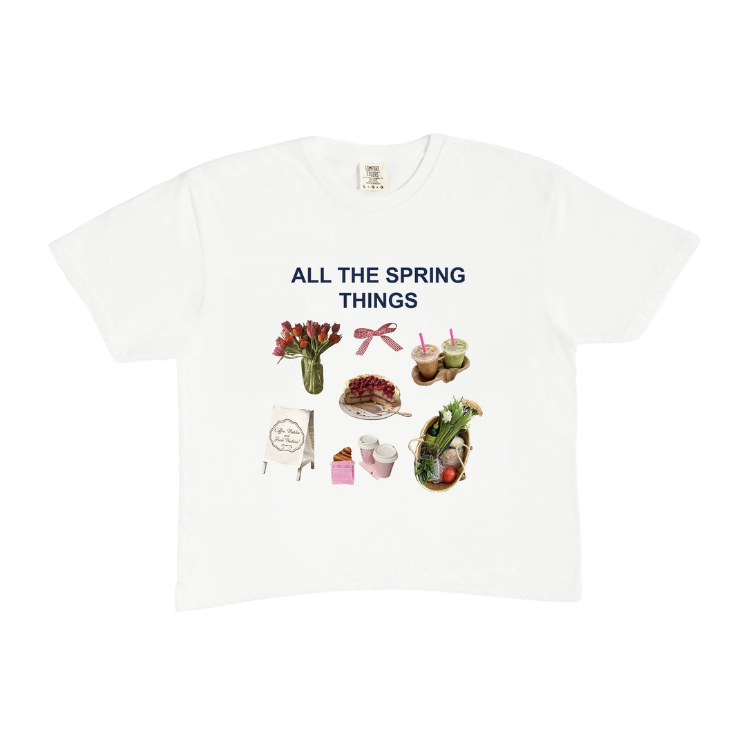 White t-shirt with spring-themed graphics and text on a white background