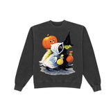 A dark gray crewneck sweatshirt featuring a colorful graphic of a cartoon witch in a black hat next to a smiling orange pumpkin, on a solid white background.