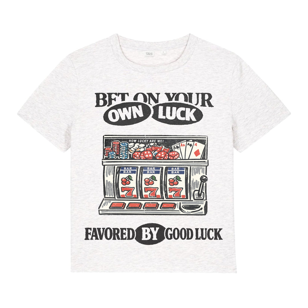 White t-shirt with a graphic design of a slot machine and text on a white background