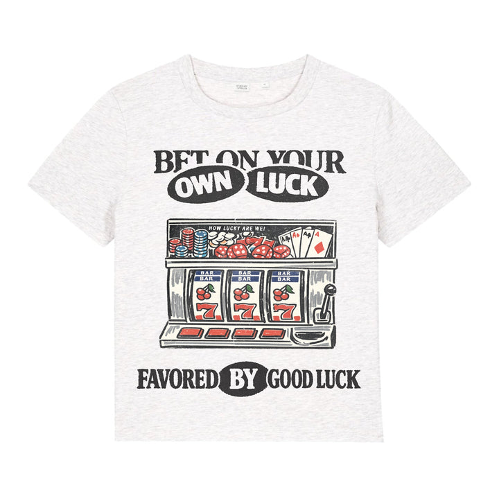 White t-shirt with a graphic design of a slot machine and text on a white background