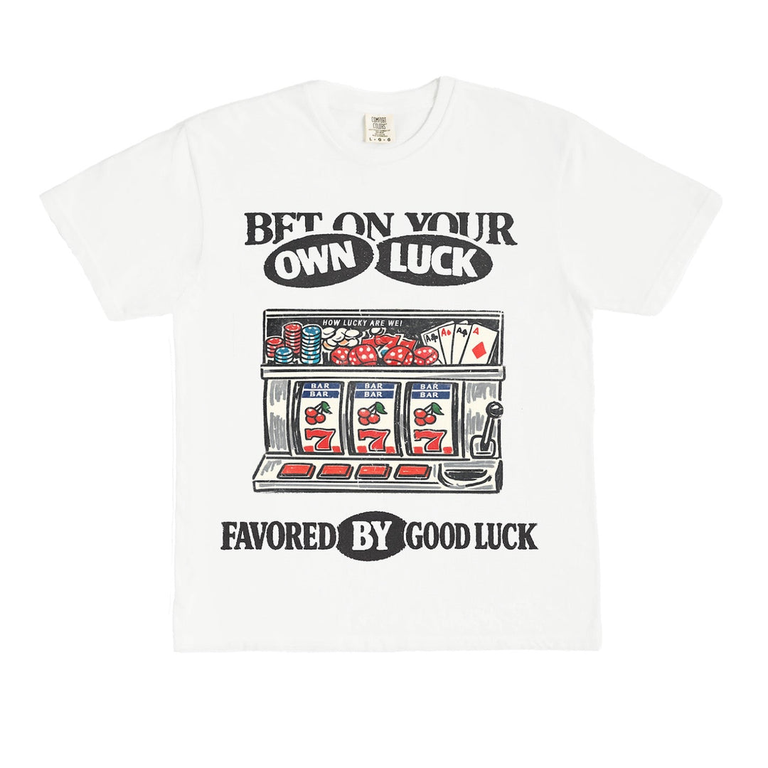 White t-shirt with slot machine graphic and text on a white background