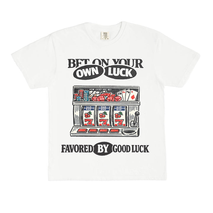 White t-shirt with slot machine graphic and text on a white background