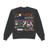 A dark gray washed crewneck sweatshirt featuring a colorful graphic print with text and illustrations on the front, displayed against a solid white background.