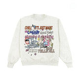 A light heather gray crewneck sweatshirt featuring a colorful graphic collage of text and cartoon illustrations on the front, displayed against a solid white background.