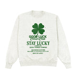 White sweatshirt with green text and clover graphic on a white background