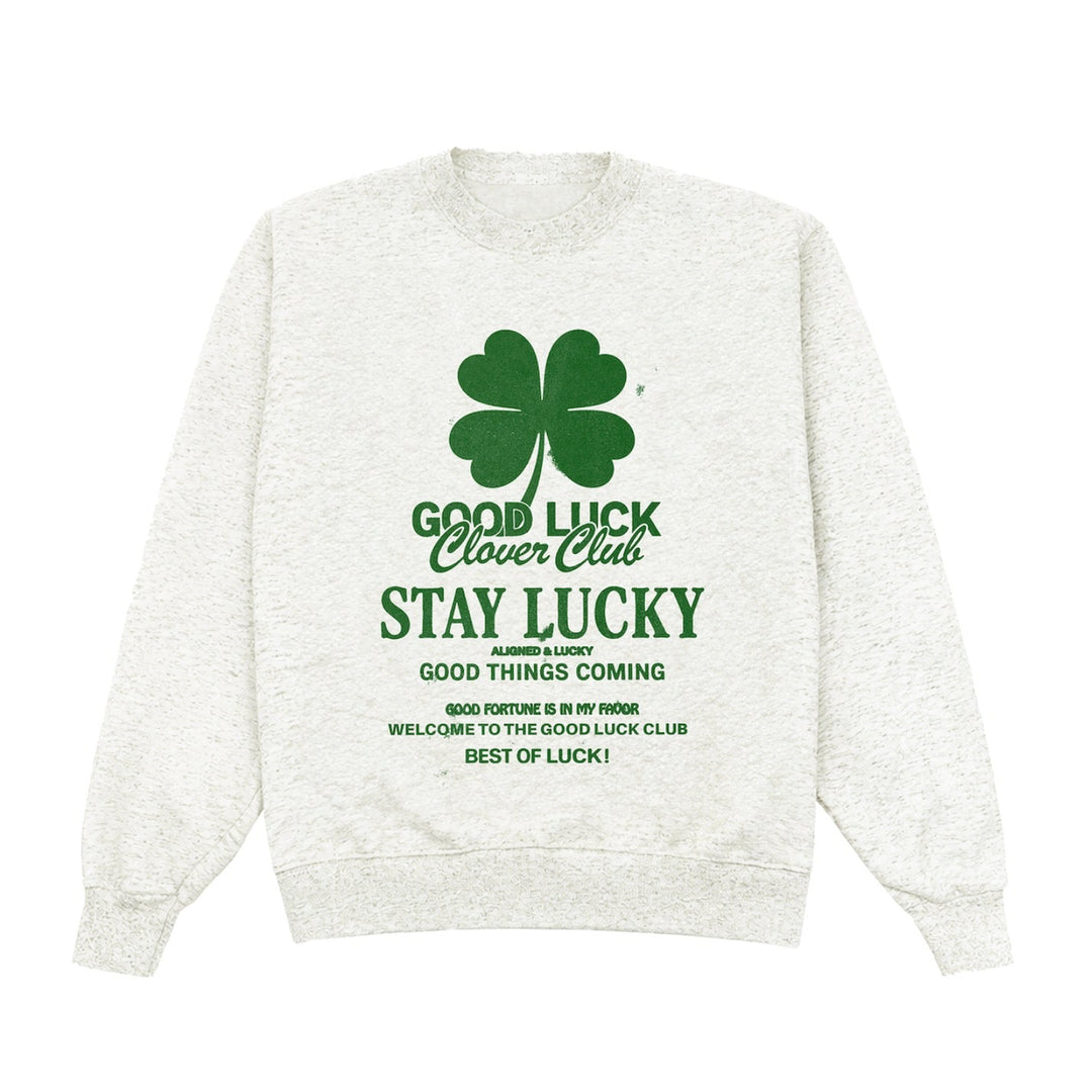 White sweatshirt with green text and clover graphic on a white background