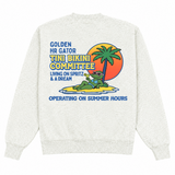 White sweatshirt with a colorful graphic of a gator on a surfboard, palm tree, and sunset.