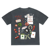 Black t-shirt with colorful graphic designs on a white background