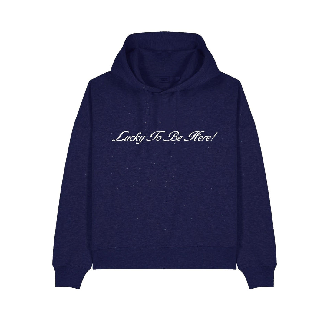Navy blue hoodie with 'Lucky To Be Here!' text on a white background