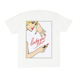 White t-shirt with graphic design of a woman applying lipstick and text 'lucky you!' on a white background