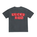 Black t-shirt with red 'LUCKY YOU' text on a white background