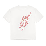 White t-shirt with red text 'lucky you!' on a white background