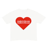 White t-shirt with a red heart-shaped logo and 'made in the usa' text on a white background