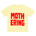 Yellow t-shirt with red text 'MOTHERING' on a white background