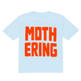 Light blue t-shirt with orange text 'MOTHERING' on a white background