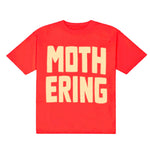 Red t-shirt with yellow text 'MOTHERING' on a white background