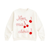 White sweatshirt with red text and cherries on a white background