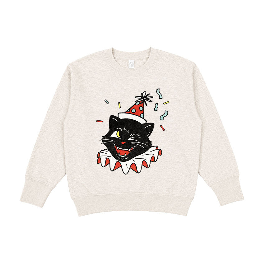 A cream-colored crewneck sweatshirt featuring a graphic of a black cat dressed as a clown with a red and white ruffled collar and a party hat, set against a plain white background.