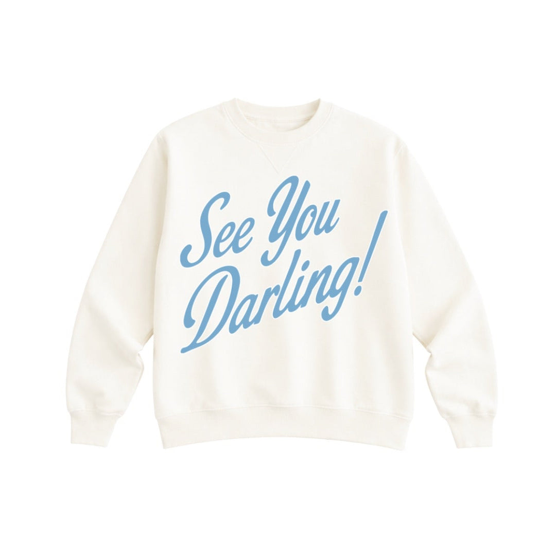 White sweatshirt with blue text 'See You Darling!' on a white background