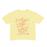 Yellow t-shirt with red fish illustrations on a white background