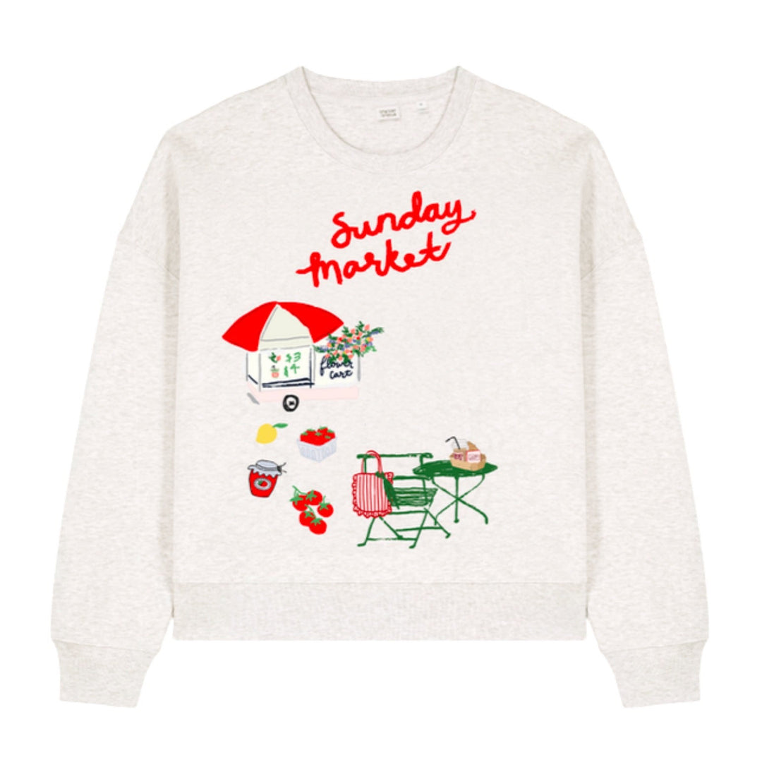 White sweatshirt with 'Sunday Market' design on a white background