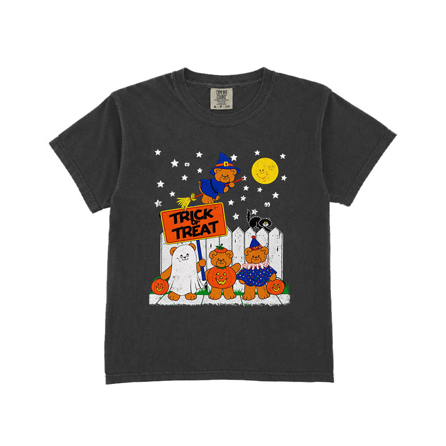 A dark charcoal gray short-sleeve t-shirt with a colorful Halloween graphic on the front, featuring cartoon characters, pumpkins, a witch, and a 'Trick or Treat' sign, displayed against a solid white background.